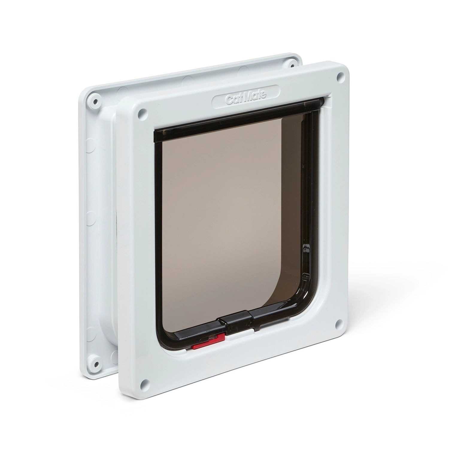 Pet door with a white frame on a white background with the red and green locks visible.