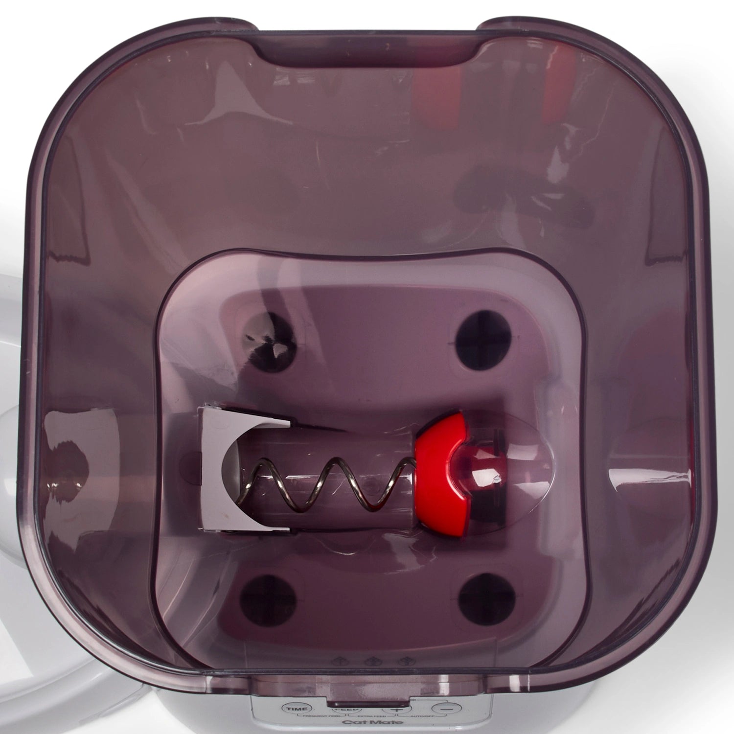 a top-down view of the inside of the feeder on a white background