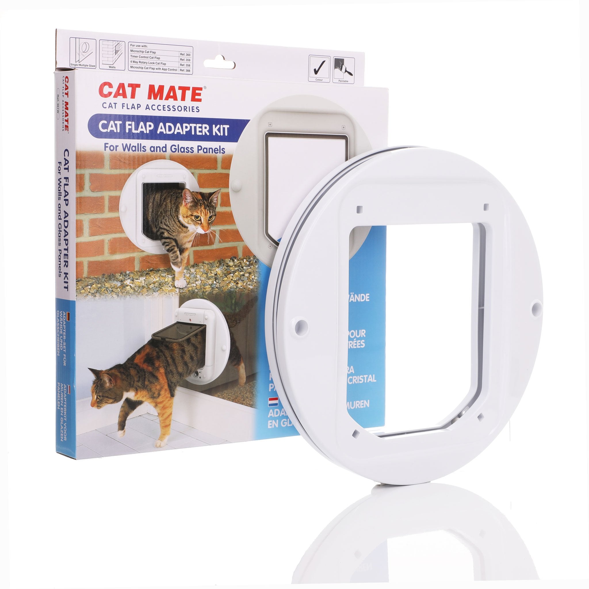 Packaging and product of the Cat Mate Cat Flap Adapter Kit, designed for walls and glass panels. The package shows images of a cat entering and exiting through a circular cat flap installed in a brick wall. The white plastic adapter ring is displayed in front of the box, showing its circular shape with a square inner opening for the flap
