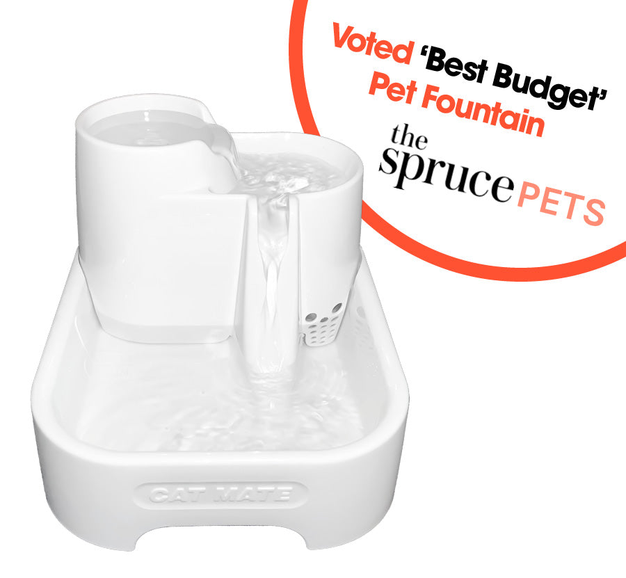 A white Cat Mate 3-level pet fountain with a 70 fl. oz. capacity, featuring a polymer-carbon filter and low voltage pump.