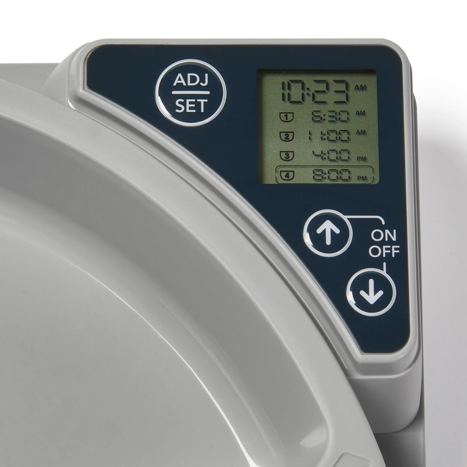 Digital control panel of the pet feeder with time display and buttons.