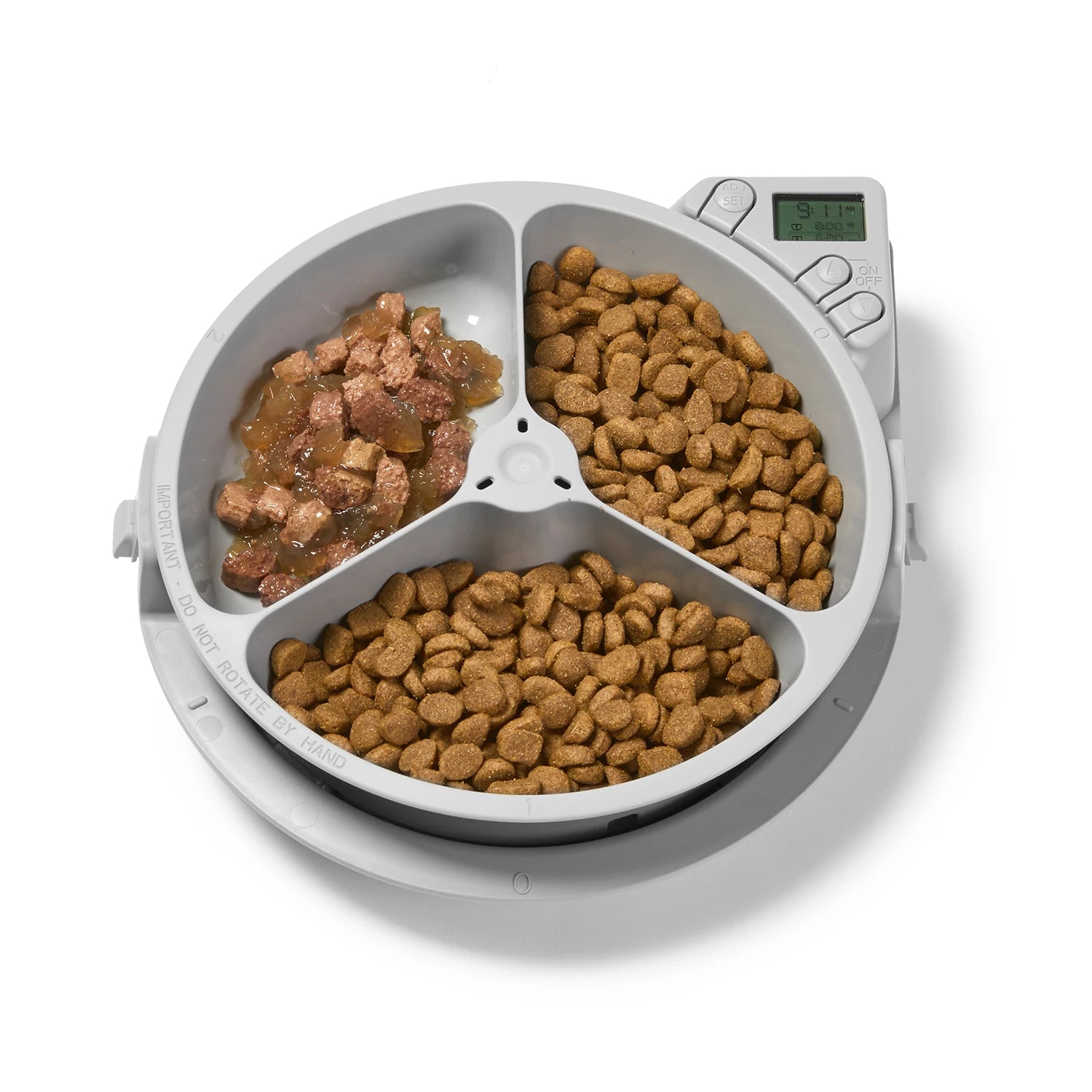 Pet food dispenser with two compartments filled with different types of pet food on a white background