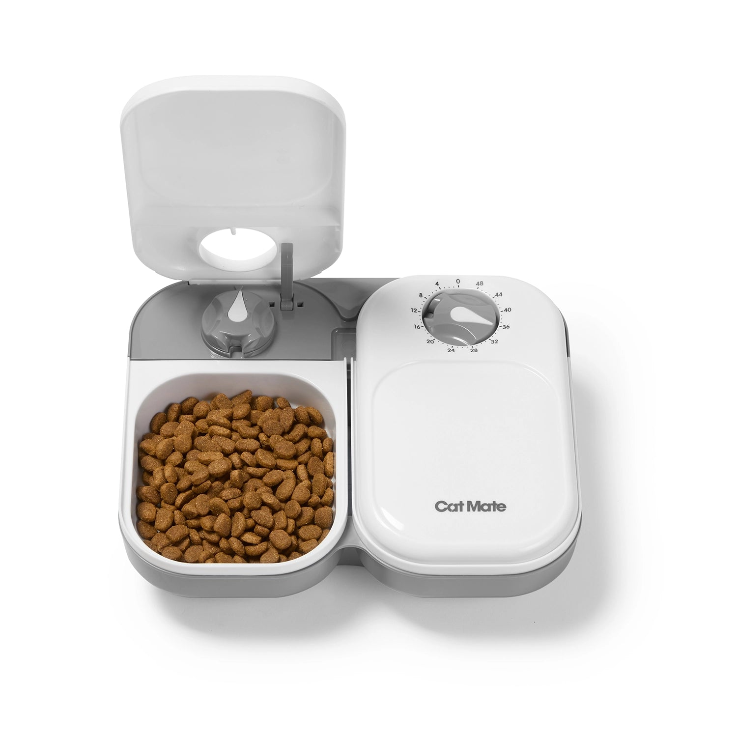 Pet food dispenser with cat food inside on a white background