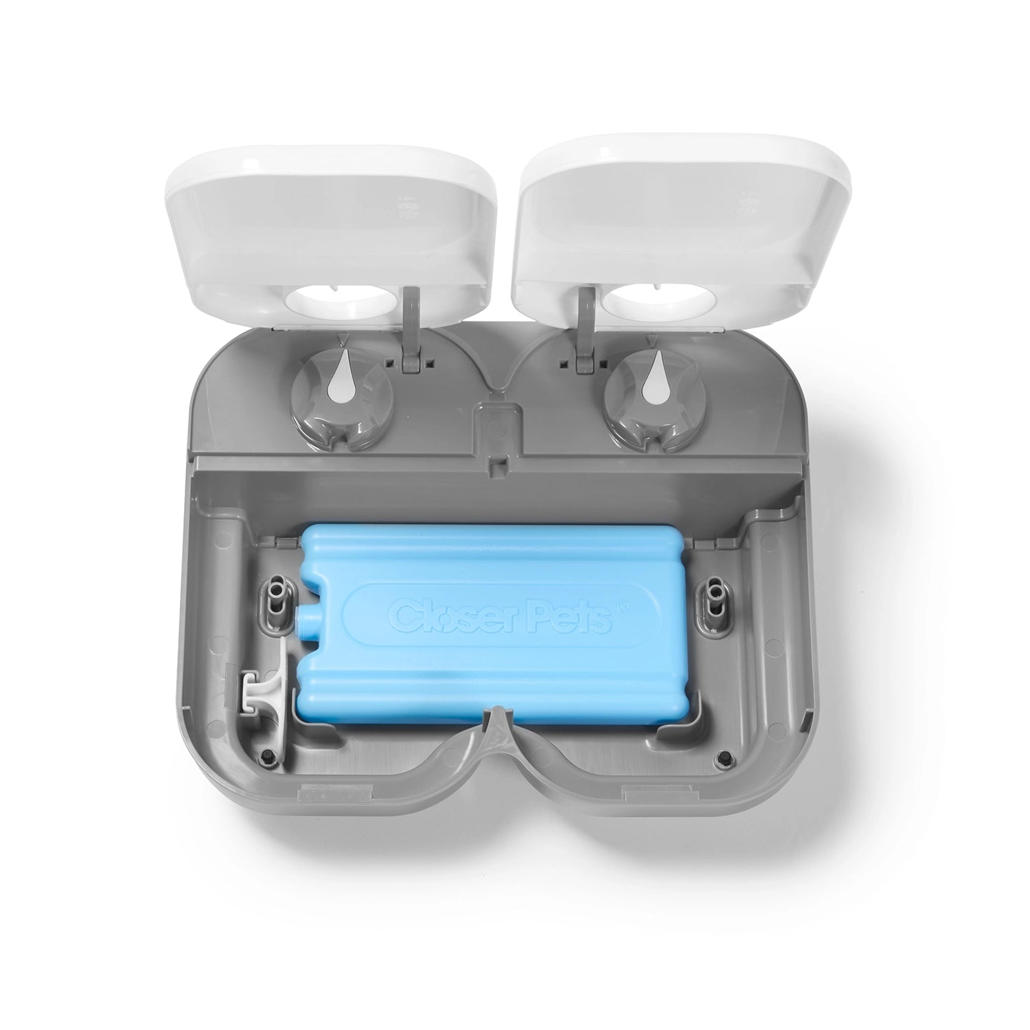 Top view of a grey and white two meal pet feeder with a blue battery inside on a white background