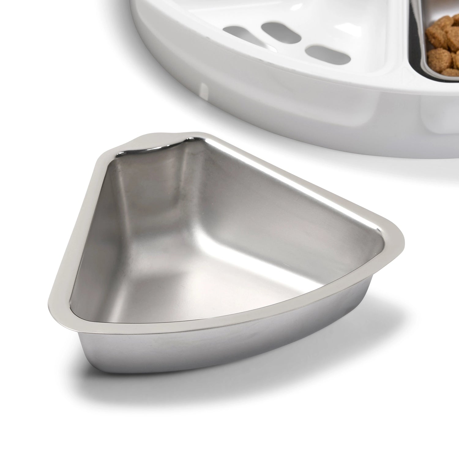 Stainless steel pet food bowl on a white background